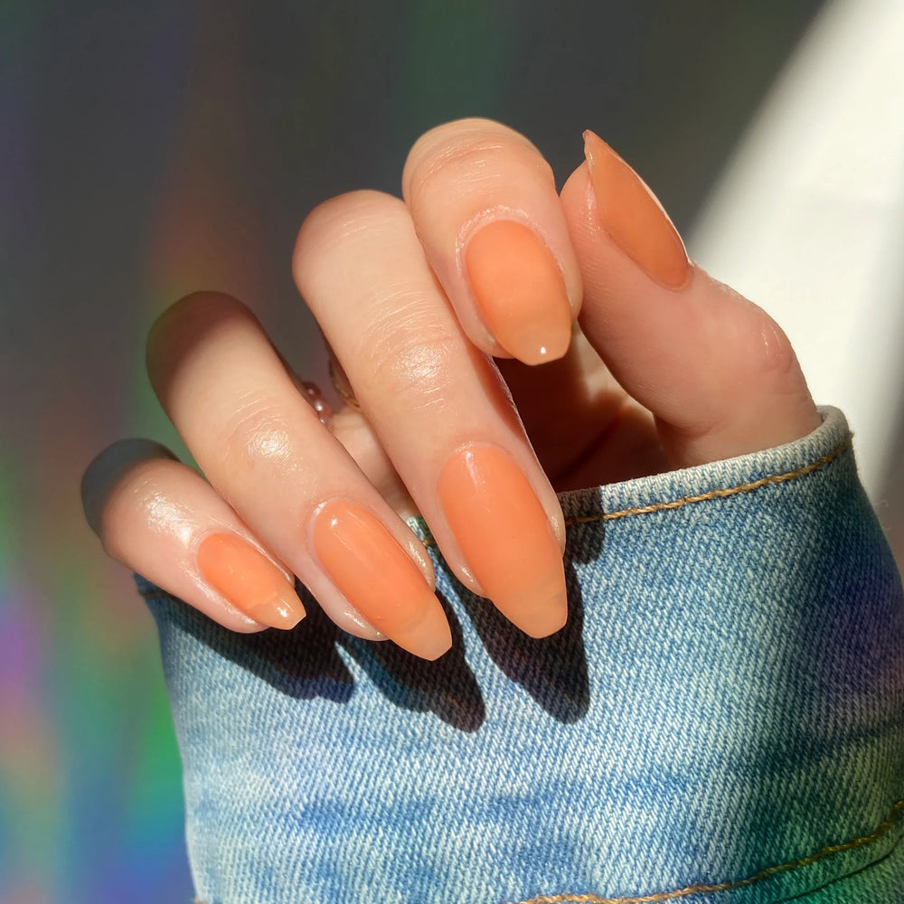 
                      
                        "Pink Rhodonite" nailpolish shown on model's hand.
                      
                    