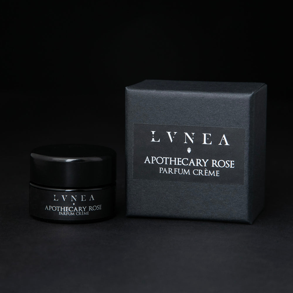 
                      
                        10g black glass jar of LVNEA's Apothecary Rose solid perfume, sitting next to its box on black background
                      
                    