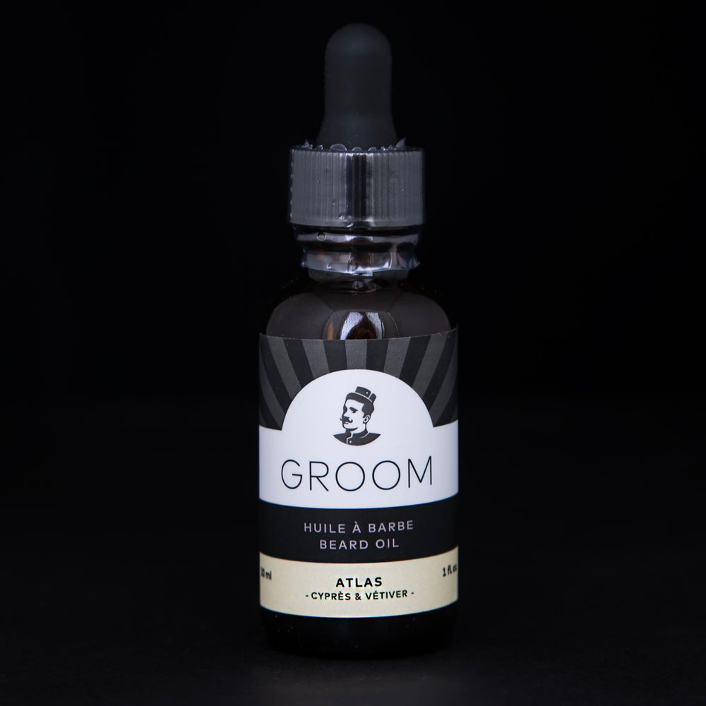 amber gass bottle with dropper top of Groom's Atlas Beard Oil