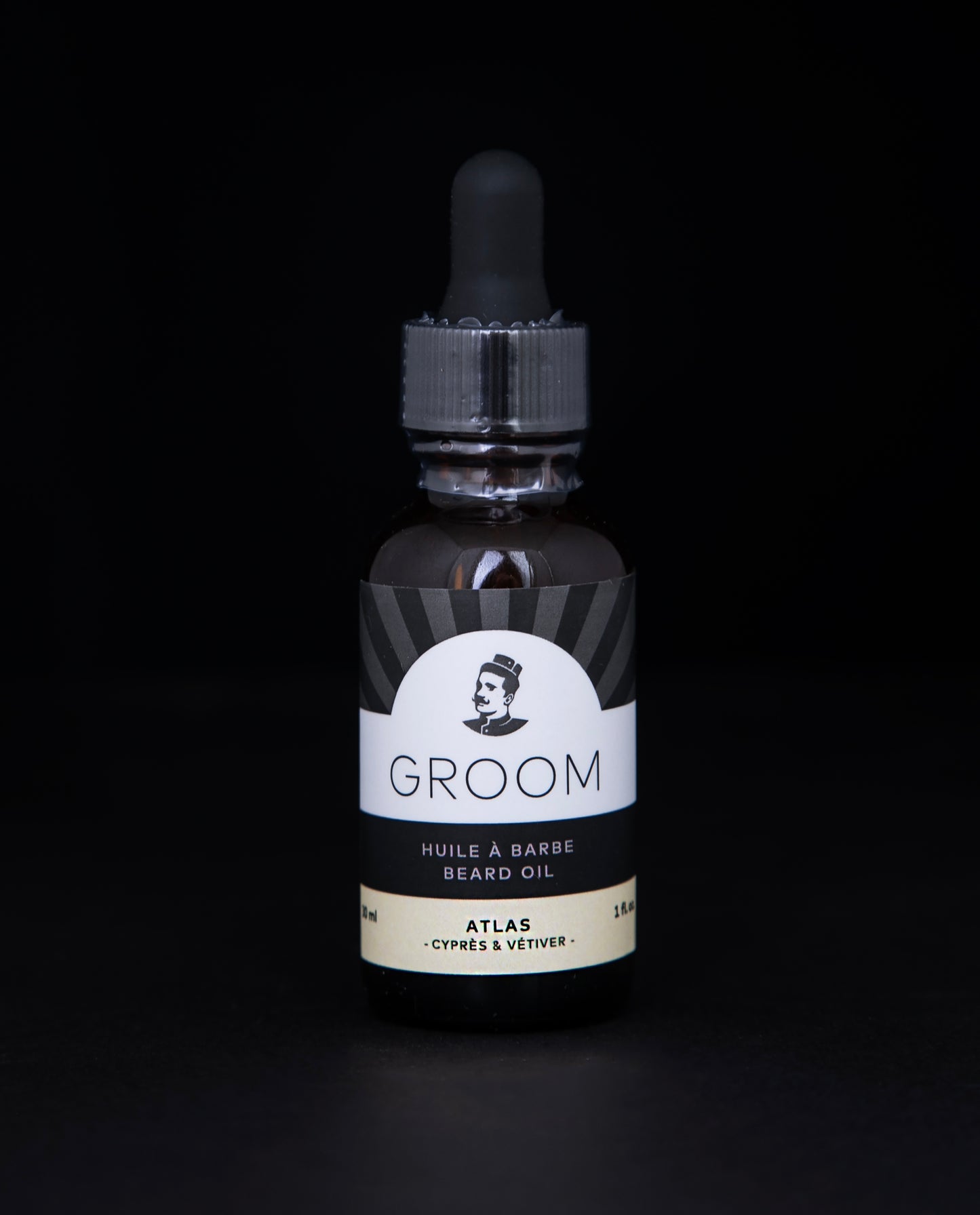 amber gass bottle with dropper top of Groom's Atlas Beard Oil