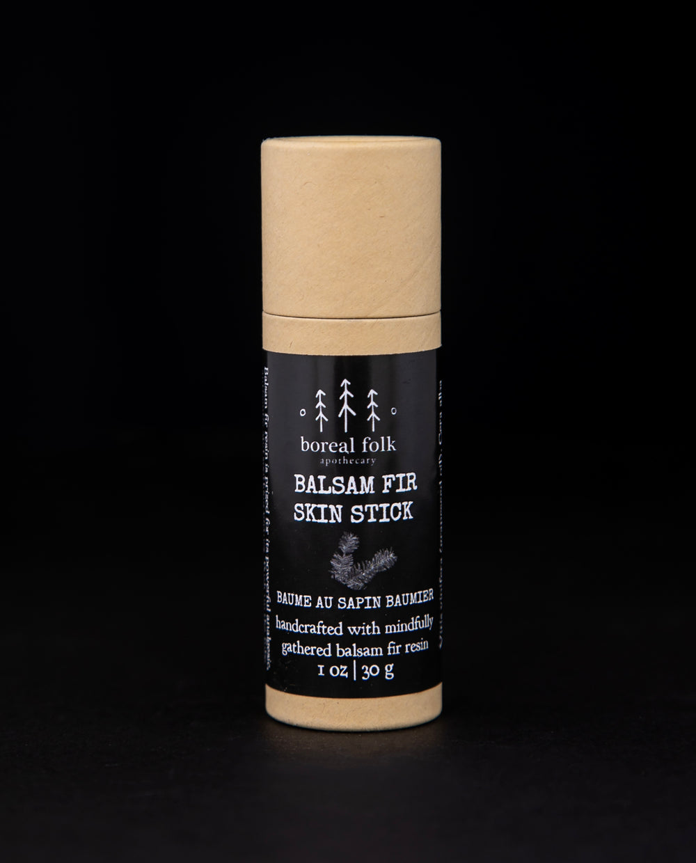 1oz balsam fir skin stick presented in a natural cardboard pushup tube