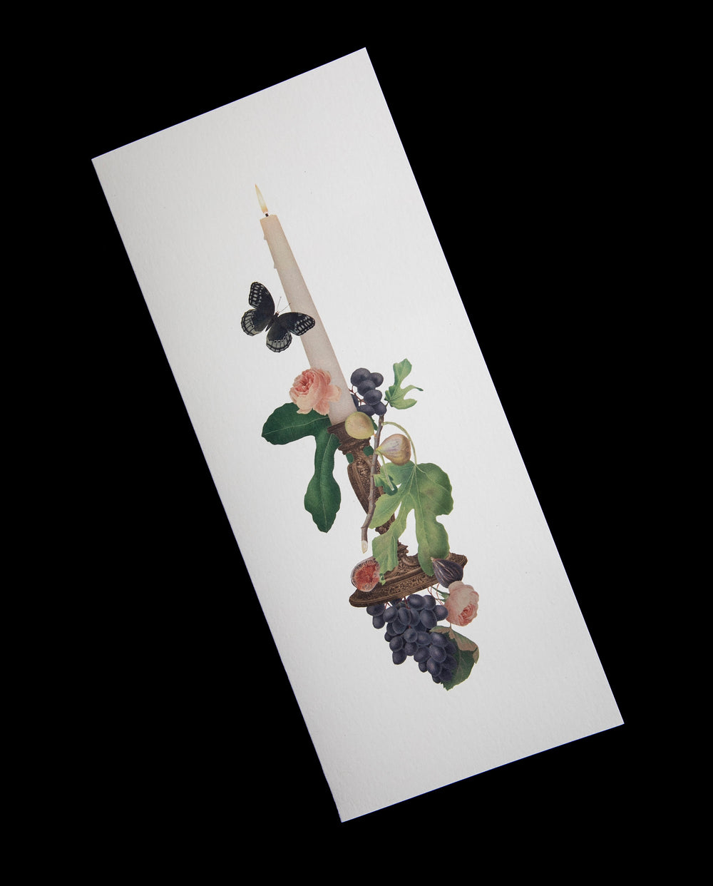 long narrow white card with candle and botanical illustration, shown against a black backdrop