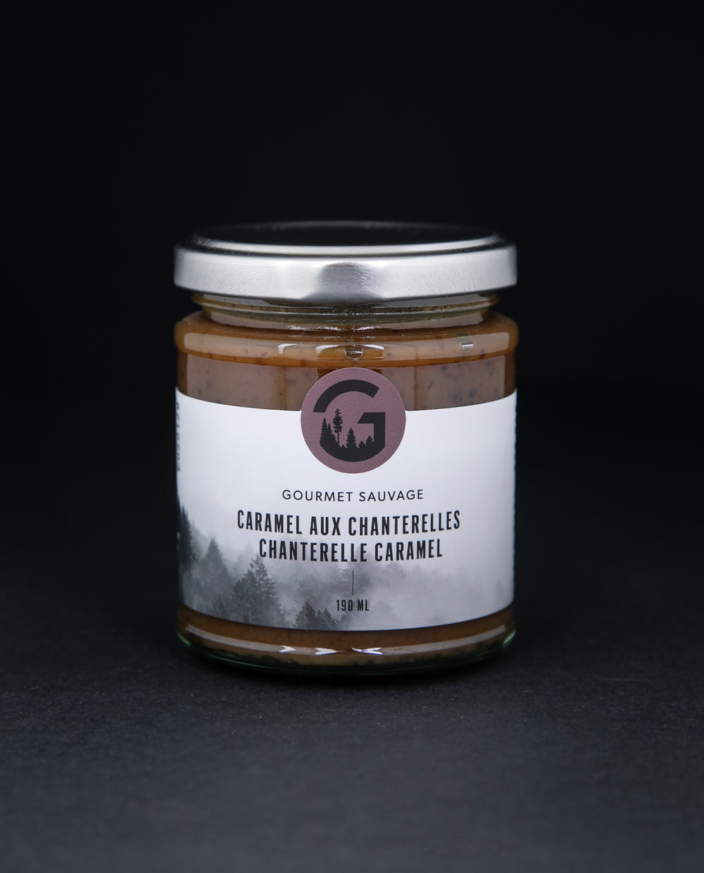 Clear glass jar with metal screw top lid containing chantelle caramel by 