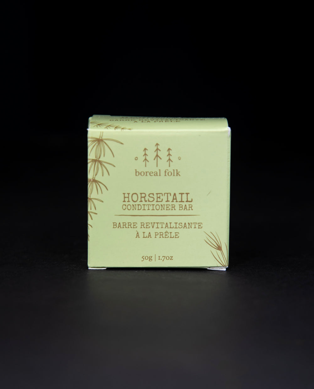 green cardboard box of Boreal Folk's horsetail conditioner against a black background