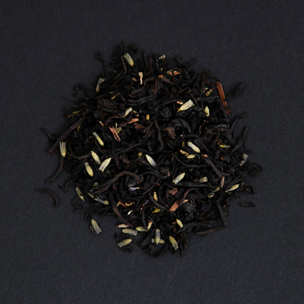 small pile of "earl grey provence" tea viewed from above against a black background