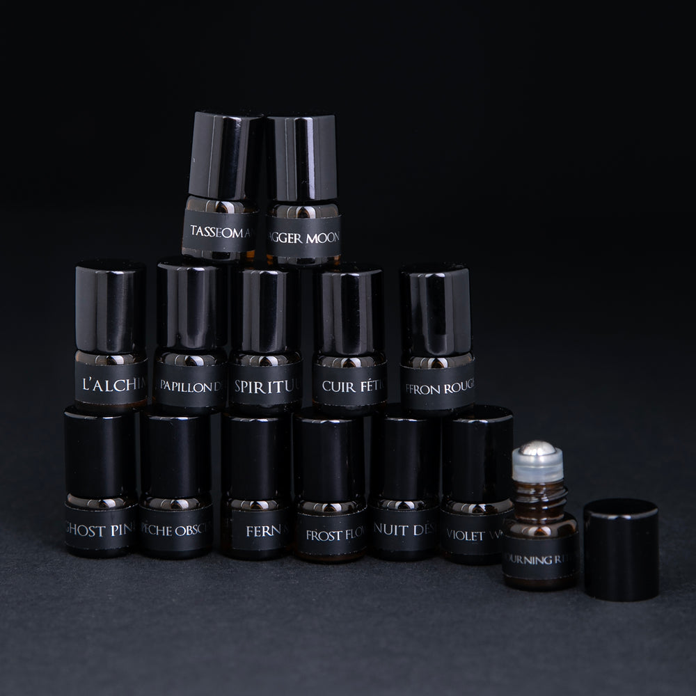 
                      
                        All 14 parfum botanique sample vials stacked up in a pyramid, against a black background.
                      
                    