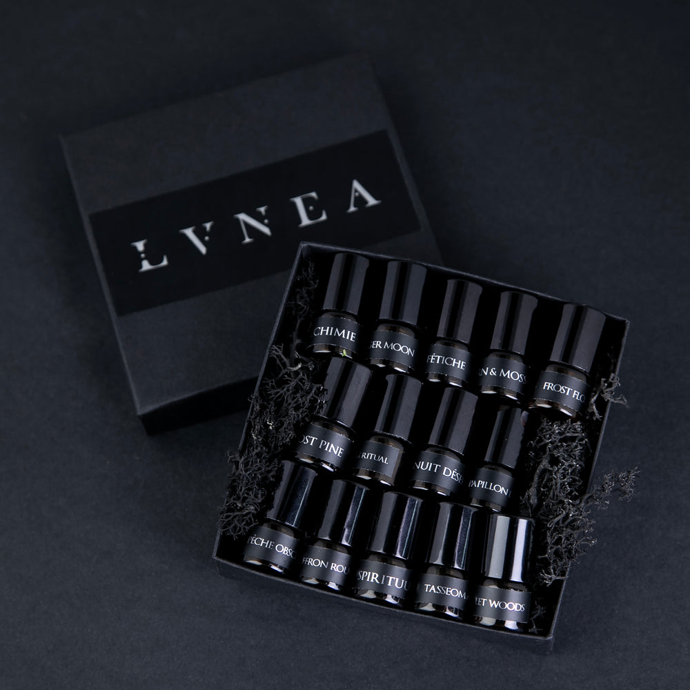 Sample set of all 14 LVNEA oil perfumes in a moss-filled black box. Sample bottles are 1.25 ml glass vials.