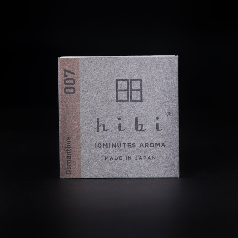 
                      
                        grey paper box of Hibi "Osmanthus" incense matches on a black background
                      
                    