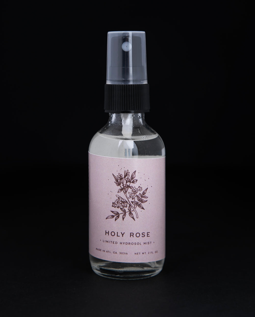 2oz clear glass bottle with black spray top of Rowan & Sage's 