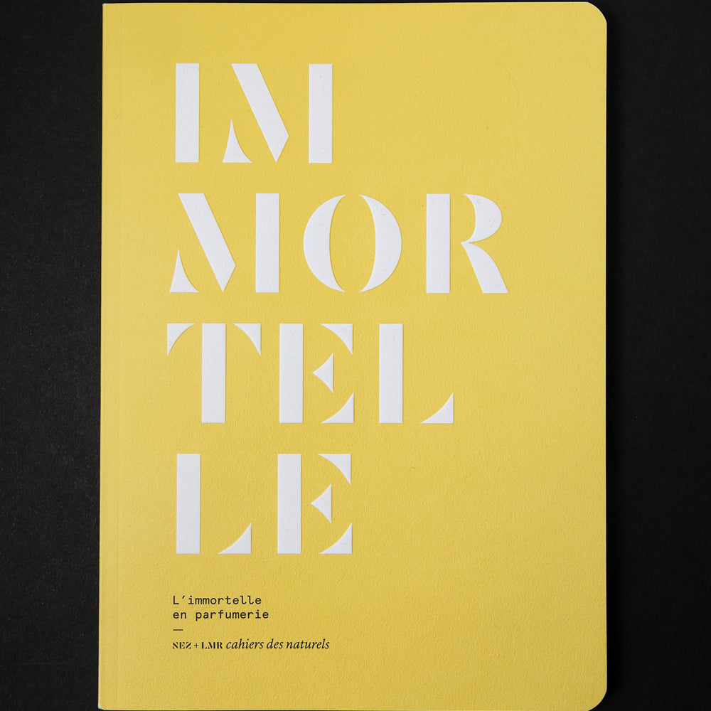 The book "l'imortelle en parfumerie" on black background. The cover is canary yellow and reads "IMORTELLE" in bold white graphic text.