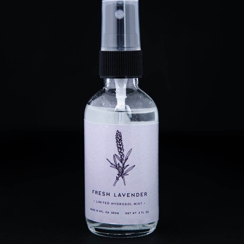 2oz clear glass bottle of Rowan & Sage's "Fresh Lavender" hydrosol. The label on the bottle is a light lavender purple colour.