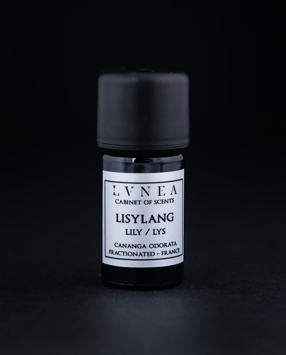 5ml black glass bottle of Lisylang essential oil on black background