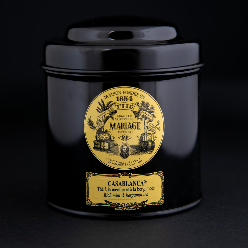 100g black laquered metal canister of Mariage Frère's "Casablanca" tea blend on black background.