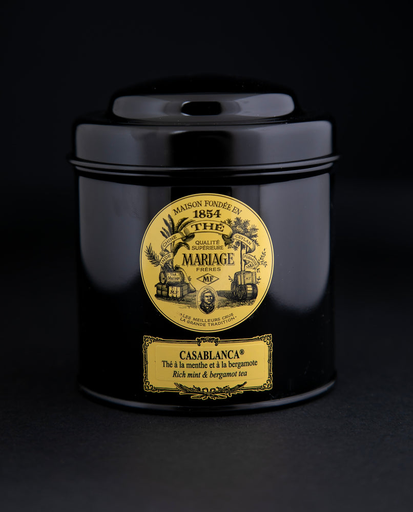 100g black laquered metal canister of Mariage Frère's "Casablanca" tea blend on black background.