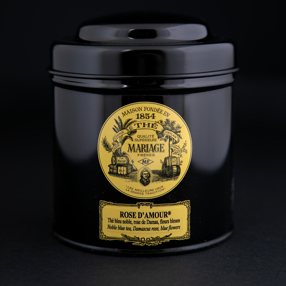 
                      
                        100g black laquered metal canister of Mariage Frère's "Rose D'amour" tea blend on black background.
                      
                    