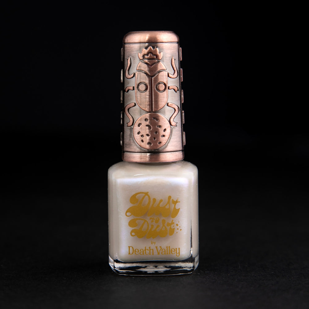 
                      
                        "Moonstone" nail polish by Death Valley Nails. The polish is an opalescent cream colour.
                      
                    