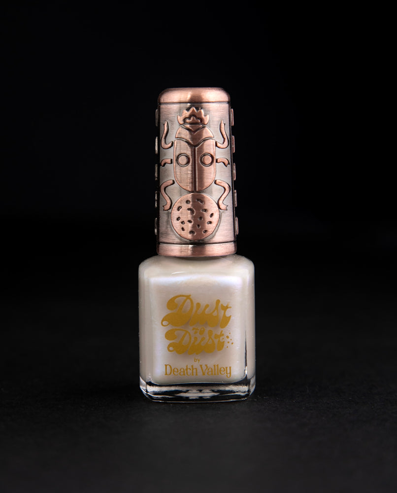 "Moonstone" nail polish by Death Valley Nails. The polish is an opalescent cream colour.