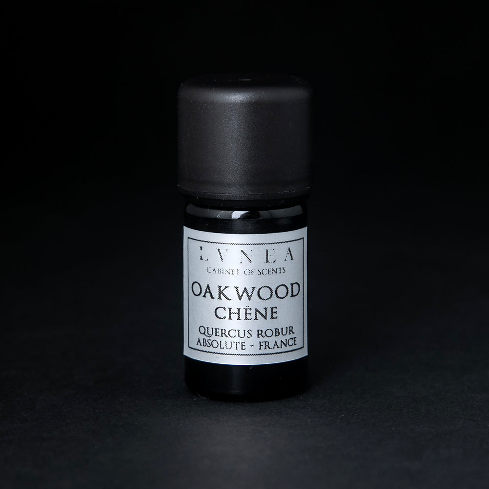 
                      
                        5ml black glass bottle of LVNEA's oakwood absolute on black background. The label on the bottle is silver.
                      
                    