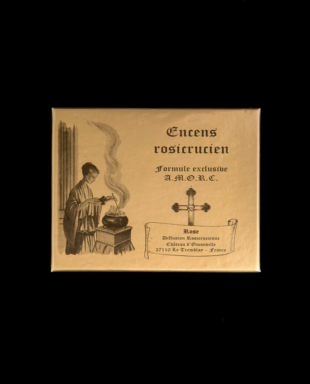 gold box of rosicrucian incense against black background