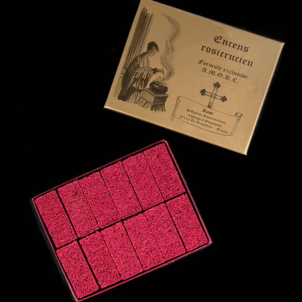 open box of rosicrucian incense, revealing 12 tightly-packed bricks of red incense