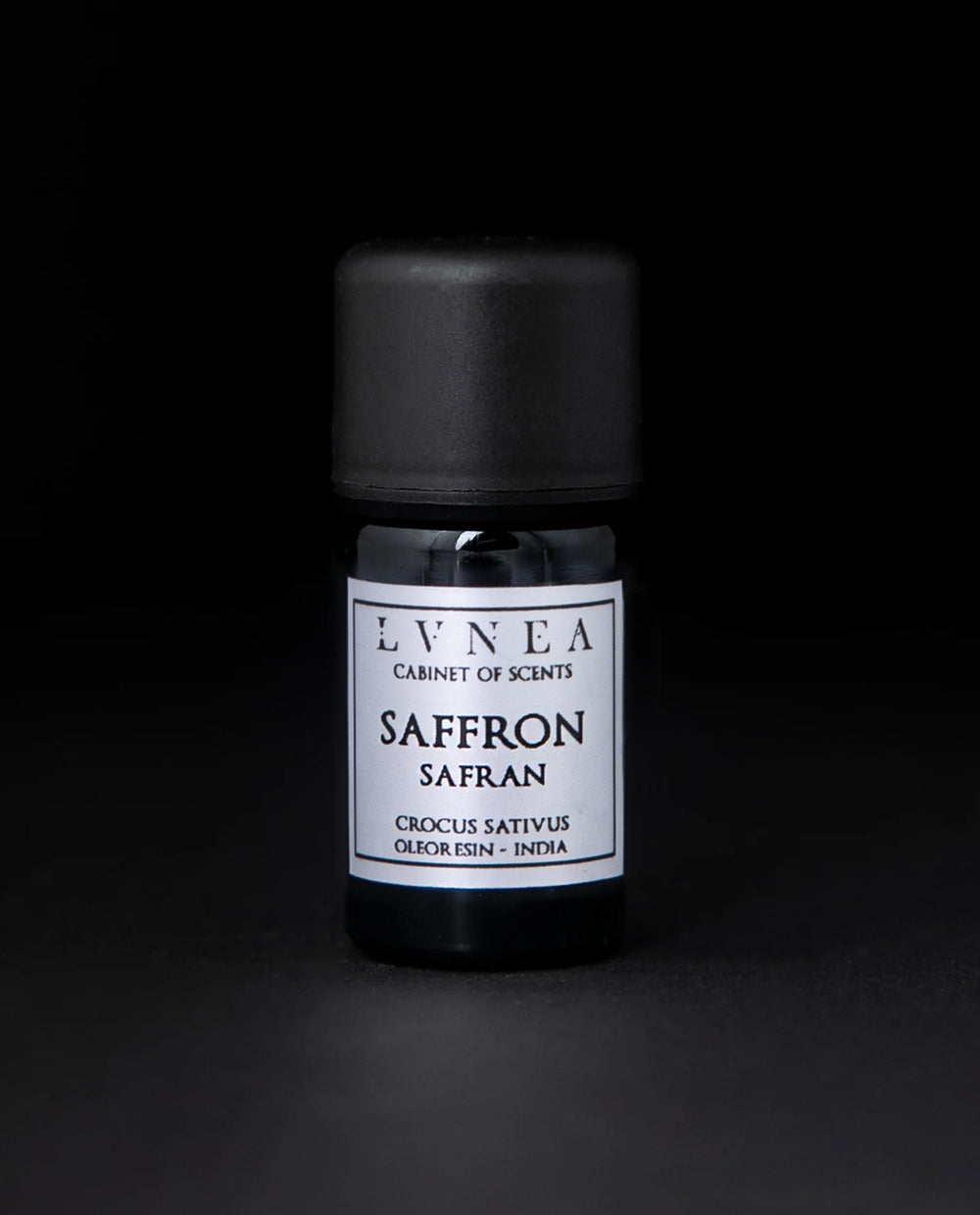 5ml black glass bottle of saffron oleoresin against a black background