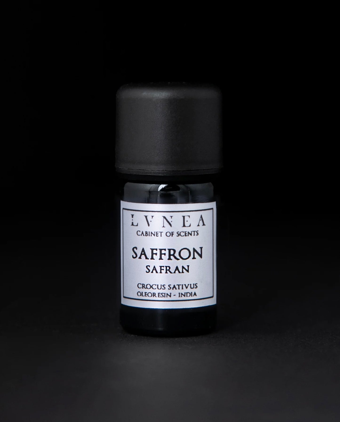 5ml black glass bottle of saffron oleoresin against a black background