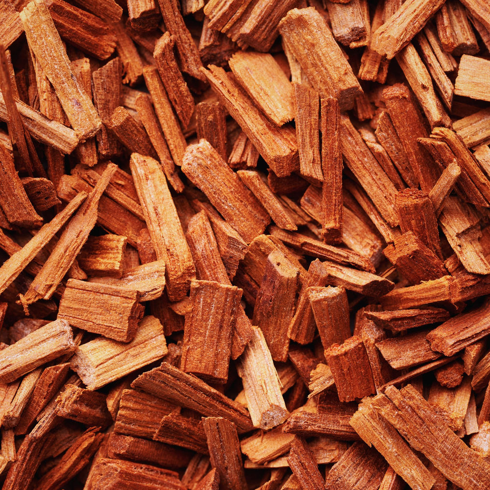 
                      
                        Close up of reddish sandalwood chips
                      
                    