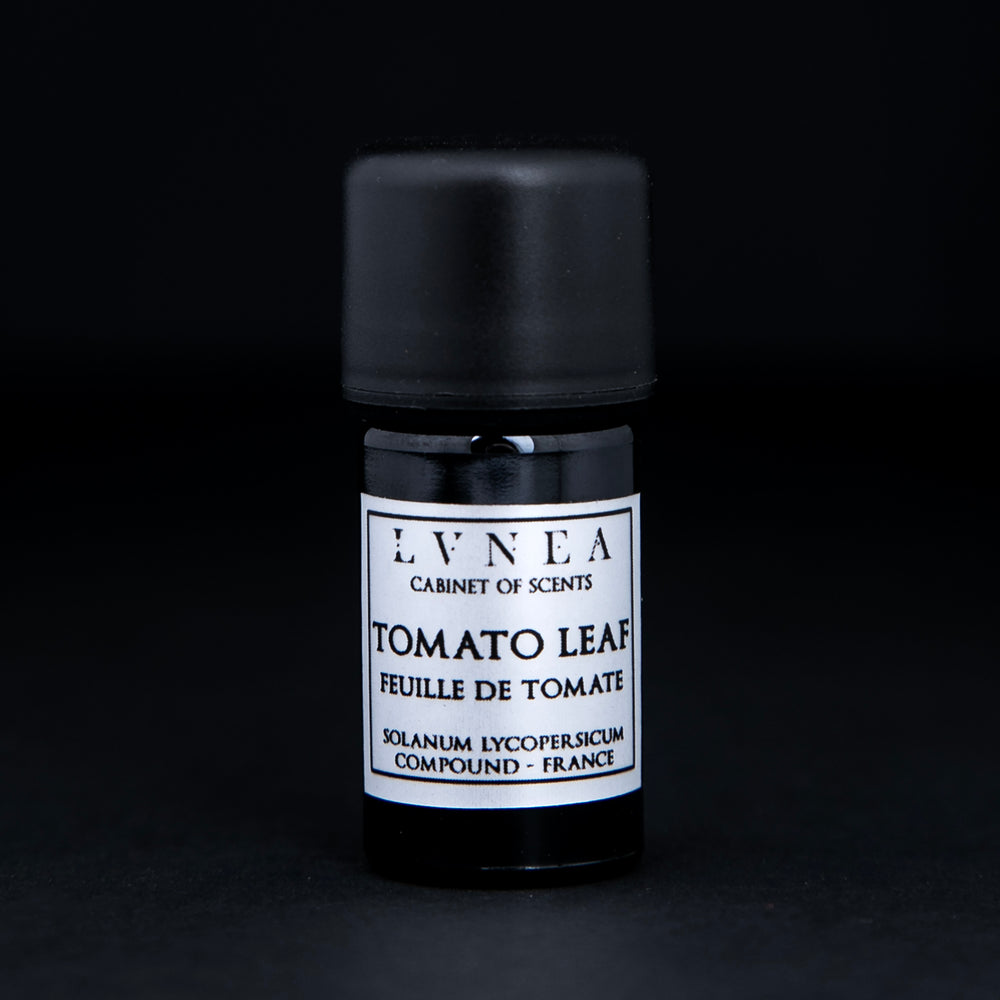 5ml black glass bottle of LVNEA's tomato leaf compound on black background. There is a silver label on the bottle.