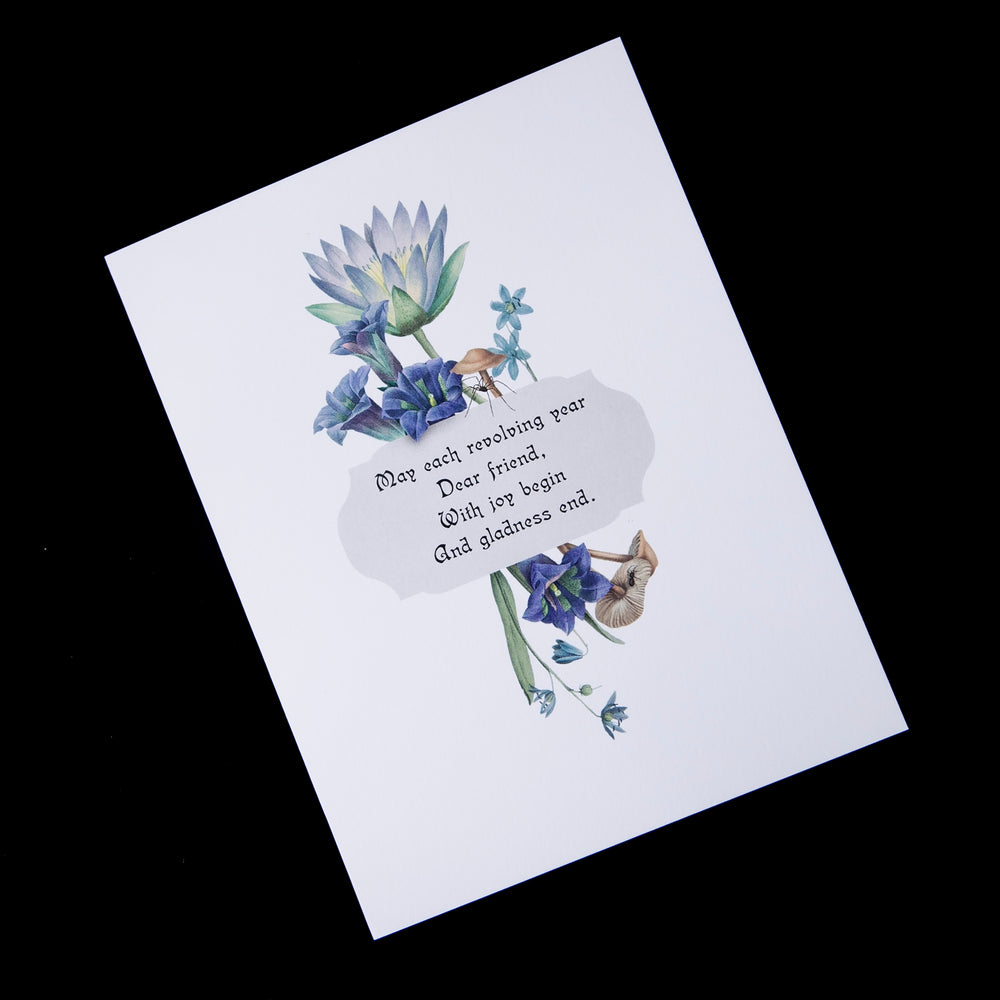 Victorian-inspired greeting card with illustration of blue lotus and other blue botanicals.