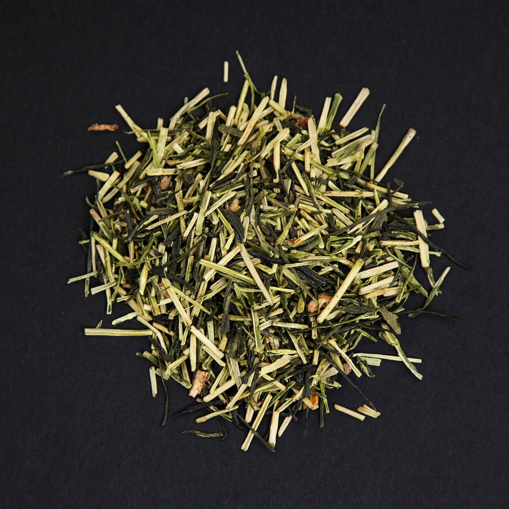 small pile of "yuzu bouquet" tea viewed from above against a black background